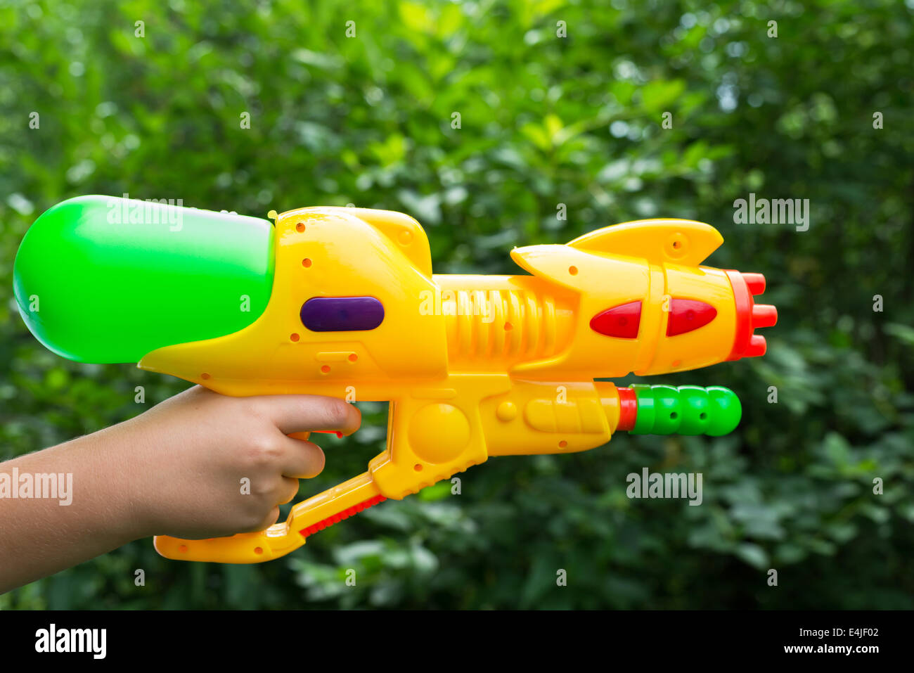 Children water gun in a children's hand Stock Photo