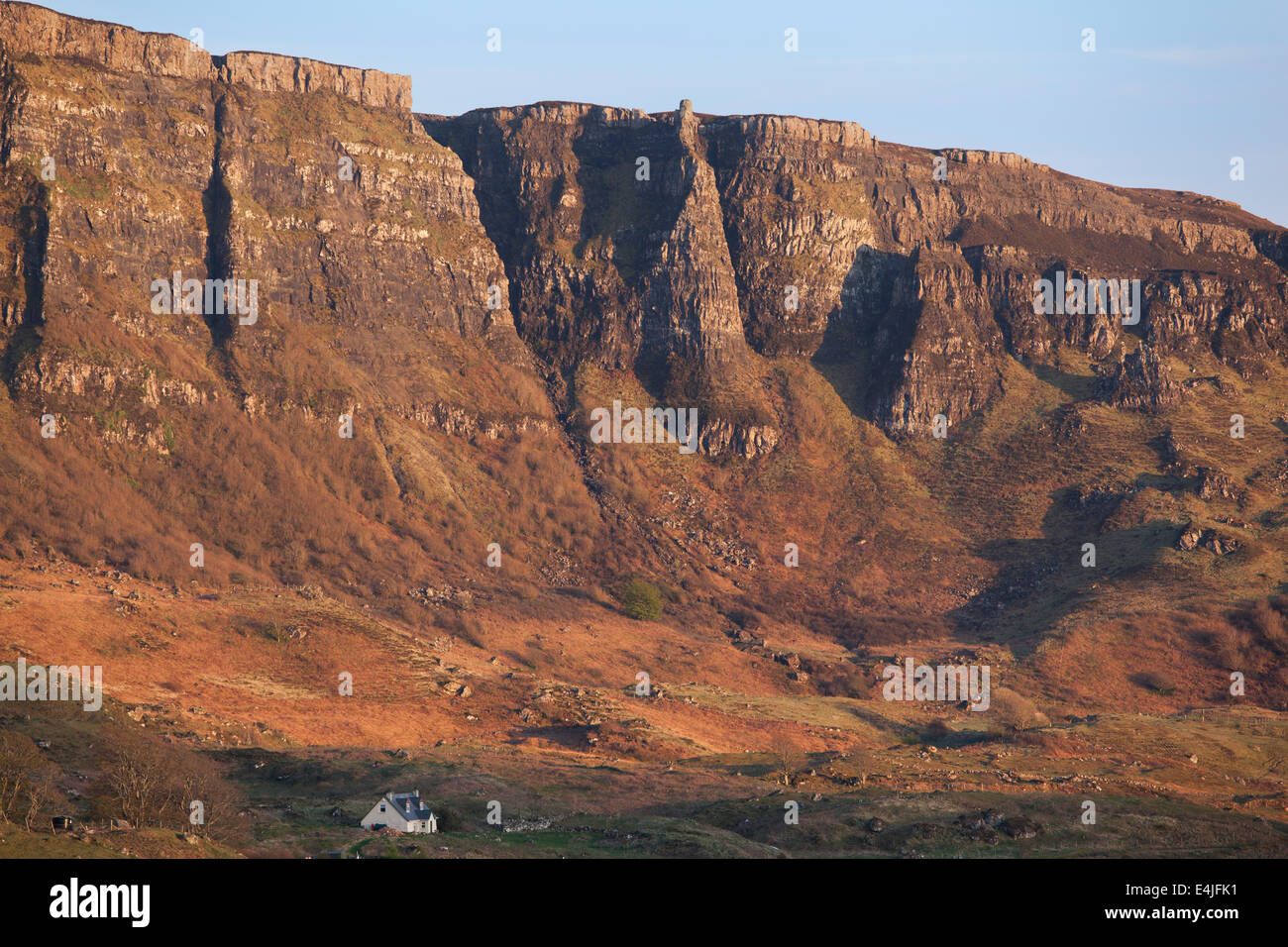 The Cleadale Cliffs on the Isle of Eigg bathed in golden evening sunlight, Small Isles, Inner Hebrides, Scotland Stock Photo