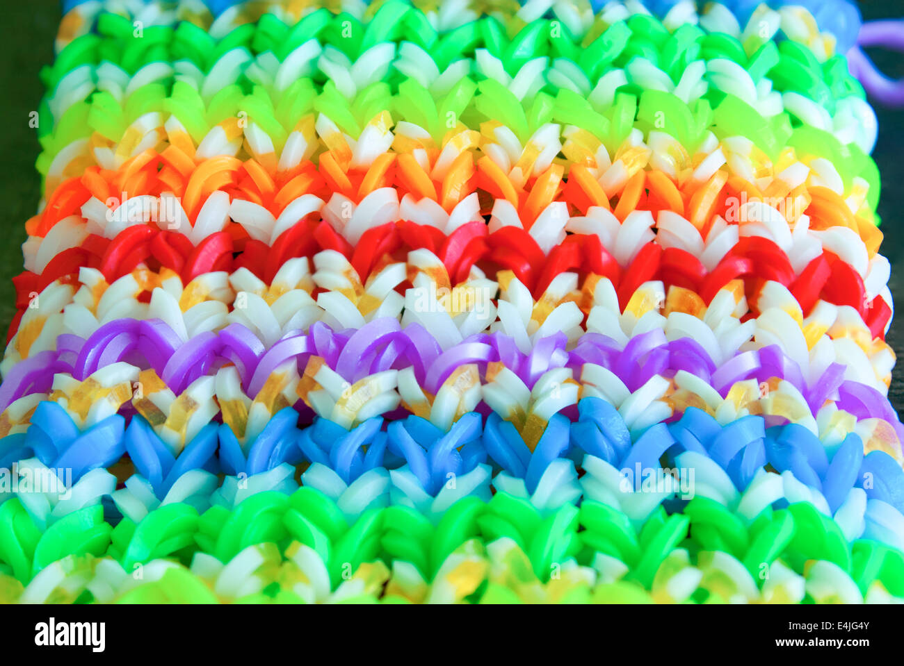 Big colorful rubber rainbow band made on loom Stock Photo Alamy