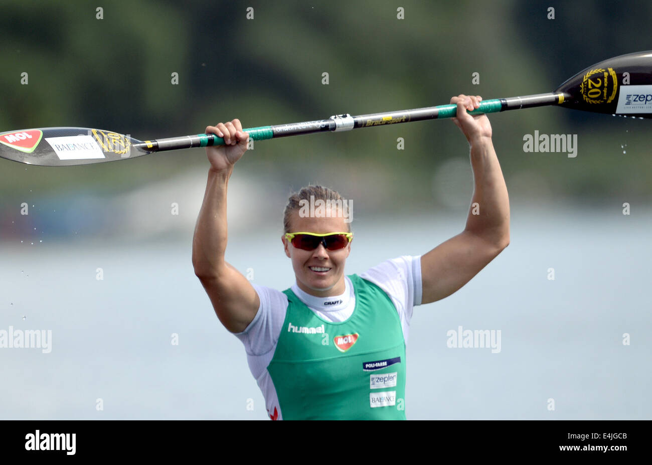 Brandenburg, Germany. 13th July, 2014. Hungarian Danuta Kozak cheers after her victory in the kayak singles class over 200 meters during the European Canoeing Championships on Lake Beetzsee in Brandenburg, Germany, 13 July 2014. The European Canoeing Championships take place from 10 to 13 July 2014. Photo: Ralf Hirschberger/dpa/Alamy Live News Stock Photo