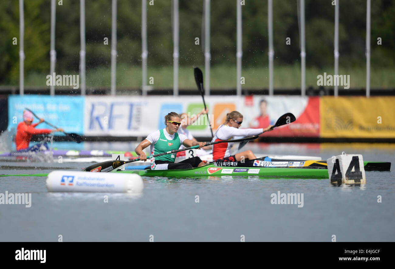 Brandenburg, Germany. 13th July, 2014. Hungarian and winner Danuta Kozak (L) and German and runner-up Franziska Weber during the kayak singles class over 200 meters during the European Canoeing Championships on Lake Beetzsee in Brandenburg, Germany, 13 July 2014. The European Canoeing Championships take place from 10 to 13 July 2014. Photo: Ralf Hirschberger/dpa/Alamy Live News Stock Photo