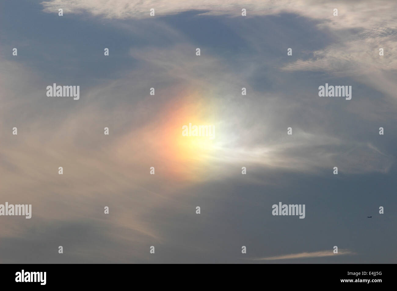 Solar flare sun clouds sky sunset airplane Stock Photo