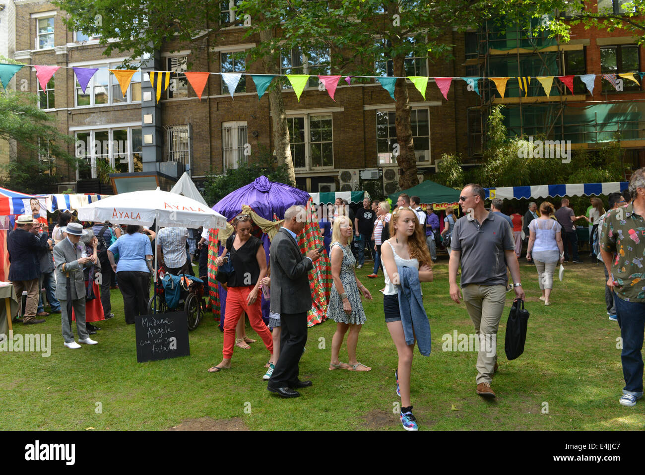 Soho, London, UK. 13th July 2014. The Soho Village Fete celebrates its 40th year with stalls, entertainments and the return of the waiters race. Credit:  Matthew Chattle/Alamy Live News Stock Photo