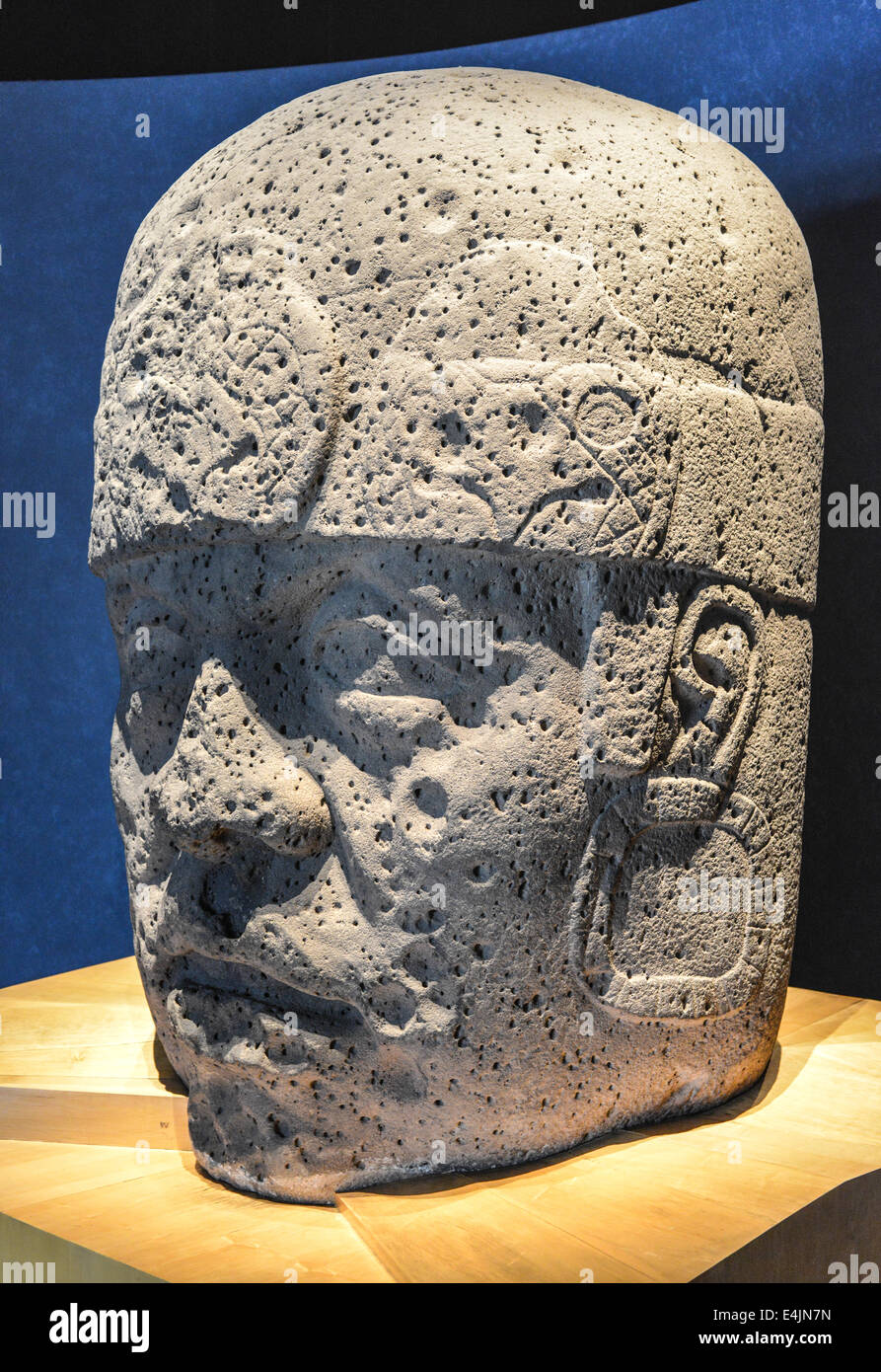 An Olmec colossal head sculpted from a large basalt boulder. The head dates from at least before 900 BC and is a distinctive fea Stock Photo