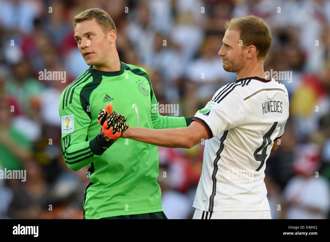Rio de Janeiro, Brazil. 13th July, 2014. Goalkeeper Manuel Neuer and Benedikt Hoewedes (R) of Germany seen during the FIFA World Cup 2014 final soccer match between Germany and Argentina at the Estadio do Maracana in Rio de Janeiro, Brazil, 13 July 2014. Photo: Marcus Brandt/dpa/Alamy Live News Stock Photo