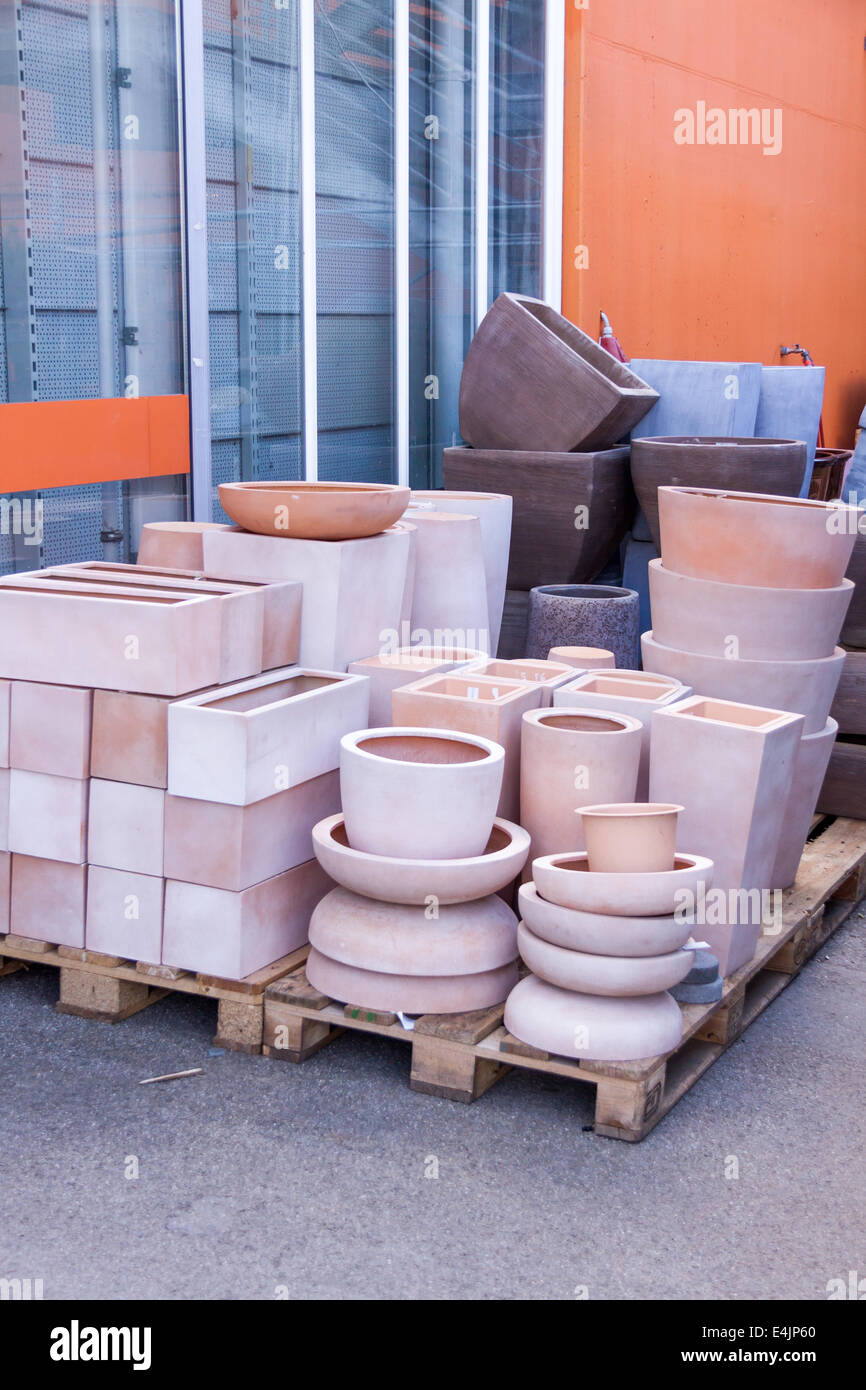 Glazed and unglazed ceramic flower pots in a variety of sizes and