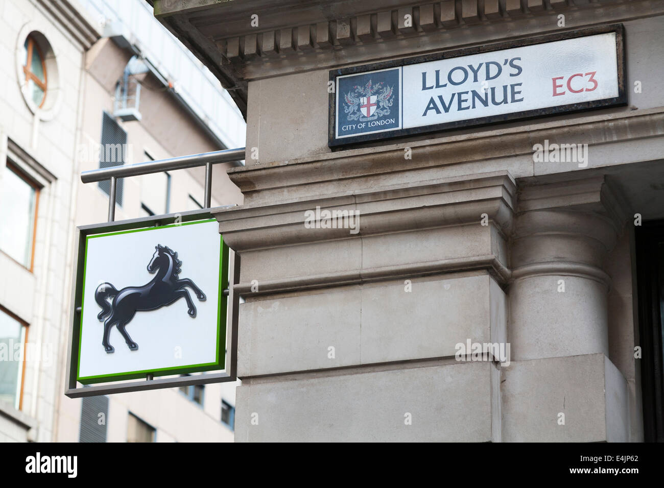 Lloyds / Lloyd's bank sign / logo at their branch on the corner of Lloyd's Avenue and Fenchurch street in the city of London. UK Stock Photo