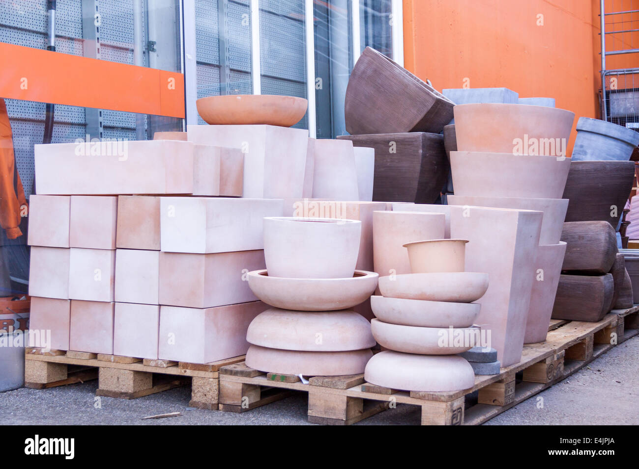 Glazed and unglazed ceramic flower pots in a variety of sizes and