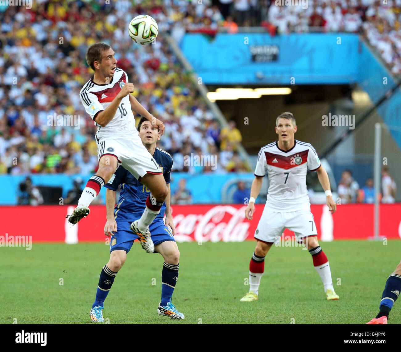 Rio de Janeiro, Brazil. 13th July, 2014. World Cup Final. Germany versus Argentina. Lahm and Messi challenge for the high ball Credit:  Action Plus Sports/Alamy Live News Stock Photo