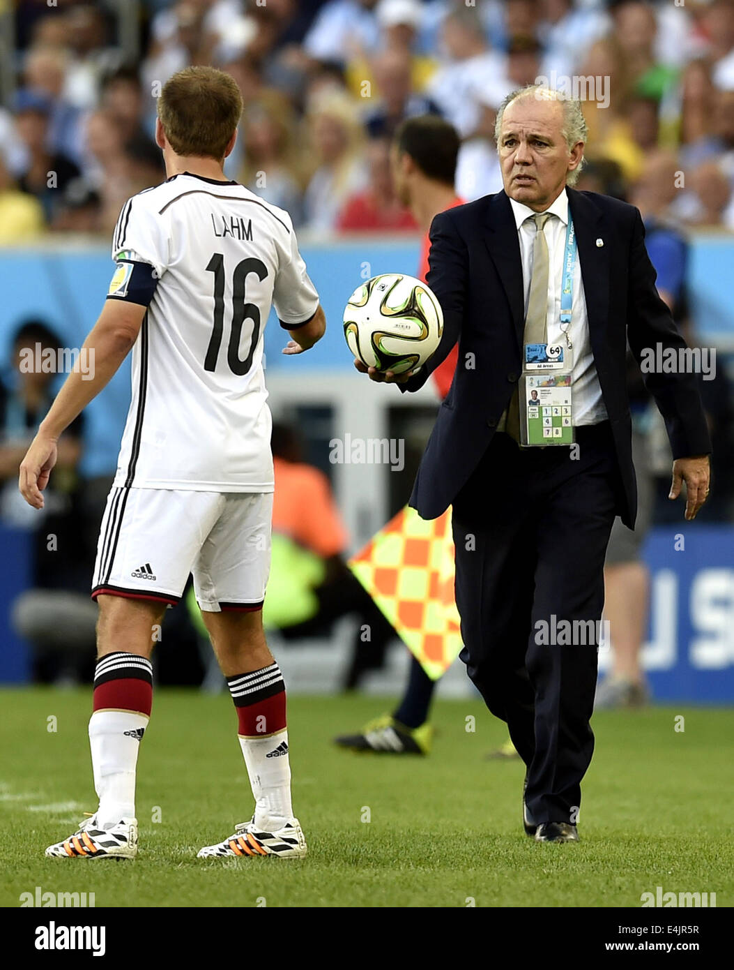 Rio De Janeiro, Brazil. 13th July, 2014. Argentina's coach Alejandro Sabella (R) gives the ball to Germany's Philipp Lahm during the final match between Germany and Argentina of 2014 FIFA World Cup at the Estadio do Maracana Stadium in Rio de Janeiro, Brazil, on July 13, 2014. Credit:  Qi Heng/Xinhua/Alamy Live News Stock Photo