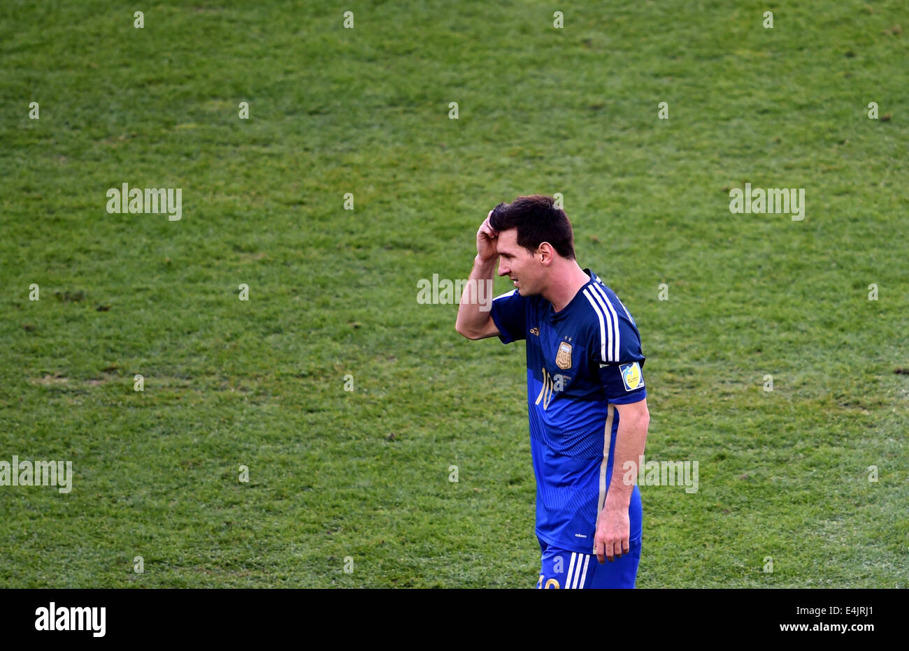 Rio De Janeiro, Brazil. 13th July, 2014. Argentina's Lionel Messi reacts during the final match between Germany and Argentina of 2014 FIFA World Cup at the Estadio do Maracana Stadium in Rio de Janeiro, Brazil, on July 13, 2014. Credit:  Li Ga/Xinhua/Alamy Live News Stock Photo