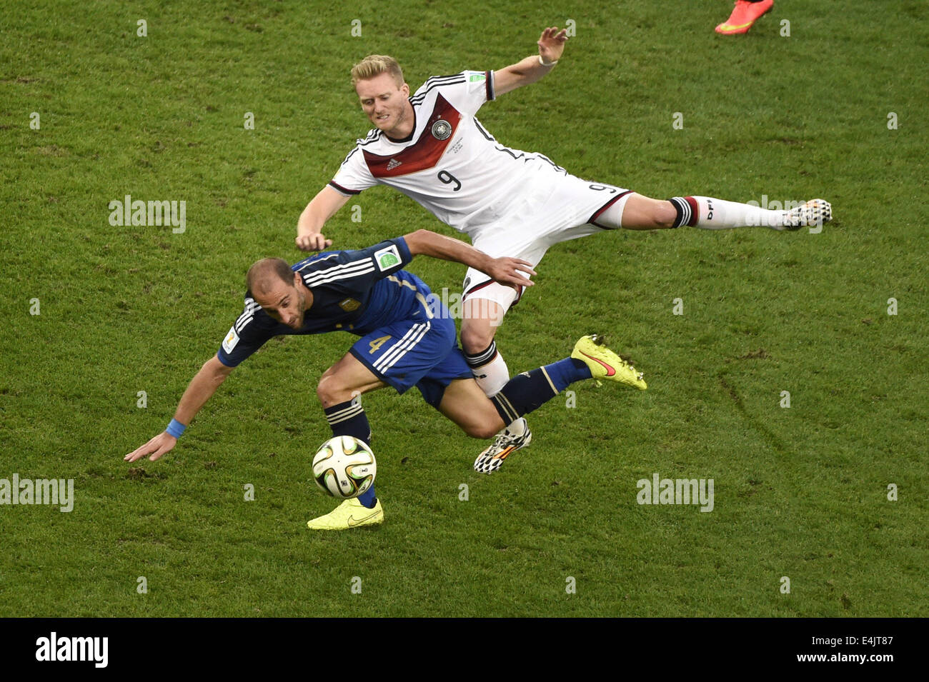 Rio De Janeiro, Brazil. 13th July, 2014. Germany's Andre Schuerrle vies with Argentina's Pablo Zabaleta during the final match between Germany and Argentina of 2014 FIFA World Cup at the Estadio do Maracana Stadium in Rio de Janeiro, Brazil, on July 13, 2014. Credit:  Lui Siu Wai/Xinhua/Alamy Live News Stock Photo