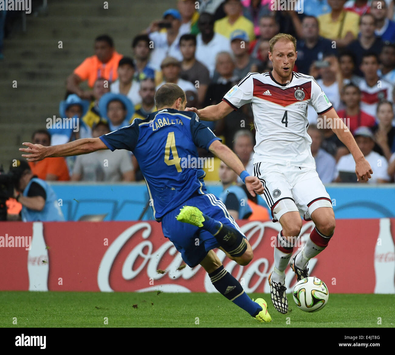 Rio De Janeiro, Brazil. 13th July, 2014. Argentina's Pablo Zabaleta (L) vies with Germany's Benedikt Howedes during the final match between Germany and Argentina of 2014 FIFA World Cup at the Estadio do Maracana Stadium in Rio de Janeiro, Brazil, on July 13, 2014. Credit:  Liu Dawei/Xinhua/Alamy Live News Stock Photo