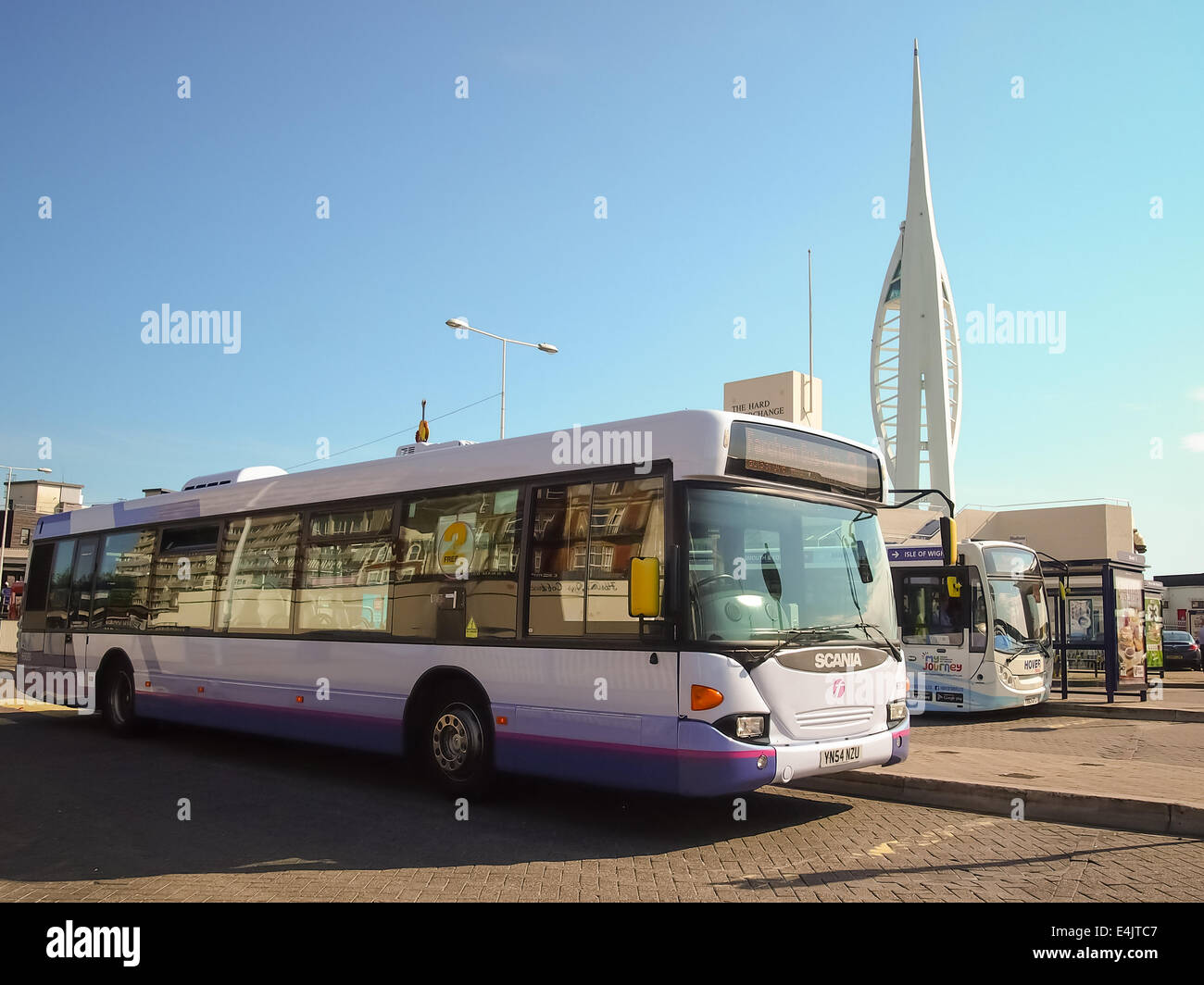 A first bus Hampshire bus standing on the Hard, Portsmouth, Hampshire, England with the Spinnaker tower in the background Stock Photo