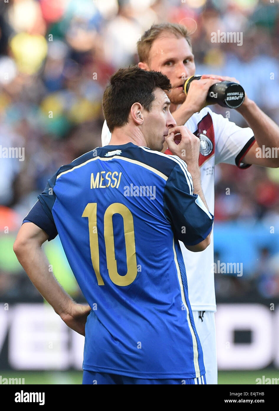 Rio De Janeiro, Brazil. 13th July, 2014. Argentina's Lionel Messi (front) reacts during the final match between Germany and Argentina of 2014 FIFA World Cup at the Estadio do Maracana Stadium in Rio de Janeiro, Brazil, on July 13, 2014. Credit:  Liu Dawei/Xinhua/Alamy Live News Stock Photo