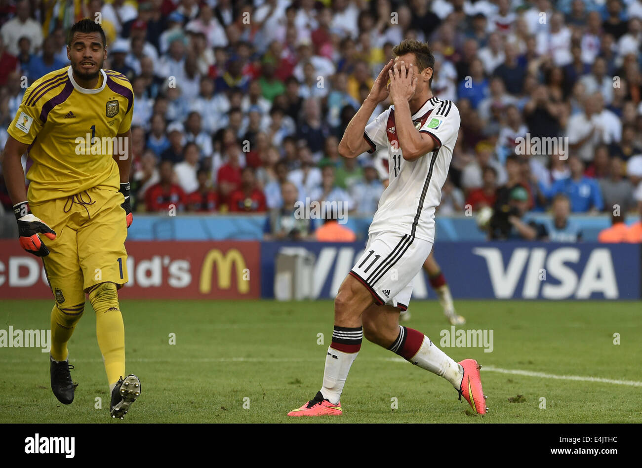 Rio De Janeiro, Brazil. 13th July, 2014. Germany's Miroslav Klose (R) reacts during the final match between Germany and Argentina of 2014 FIFA World Cup at the Estadio do Maracana Stadium in Rio de Janeiro, Brazil, on July 13, 2014. Credit:  Yang Lei/Xinhua/Alamy Live News Stock Photo