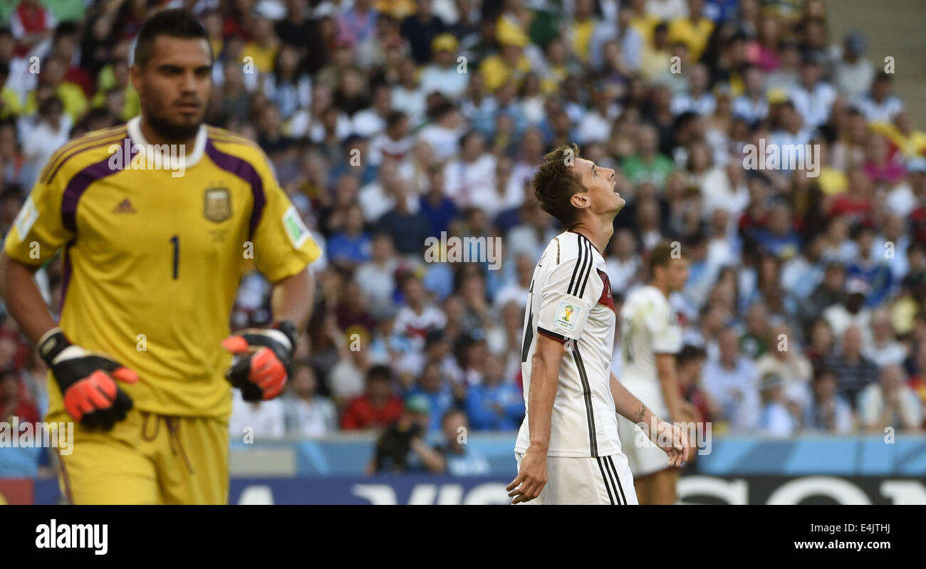 Rio De Janeiro, Brazil. 13th July, 2014. Germany's Miroslav Klose (R) reacts during the final match between Germany and Argentina of 2014 FIFA World Cup at the Estadio do Maracana Stadium in Rio de Janeiro, Brazil, on July 13, 2014. Credit:  Yang Lei/Xinhua/Alamy Live News Stock Photo