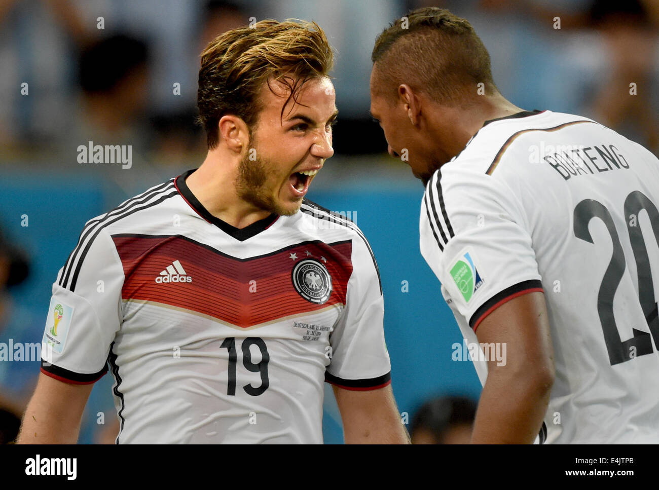 Rio de Janeiro, Brazil. 13th July, 2014. dpatopbilder Mario Goetze (L) of Germany celebrates with teammate Jerome Boateng after scoring 1-0 goal during the FIFA World Cup 2014 final soccer match between Germany and Argentina at the Estadio do Maracana in Rio de Janeiro, Brazil, 13 July 2014. Photo: Marcus Brandt/dpa/Alamy Live News Stock Photo