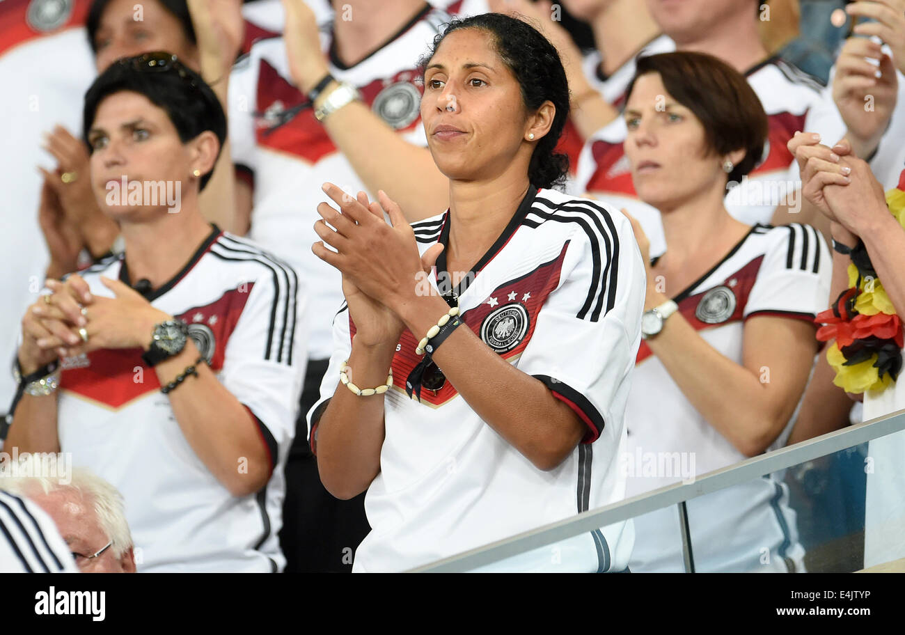 Rio de Janeiro, Brazil. 13th July, 2014. Steffi Jones (C) of Germany, director of the German Football Association (DFB), seen in the stands during the FIFA World Cup 2014 final soccer match between Germany and Argentina at the Estadio do Maracana in Rio de Janeiro, Brazil, 13 July 2014. Photo: Marcus Brandt/dpa/Alamy Live News Stock Photo