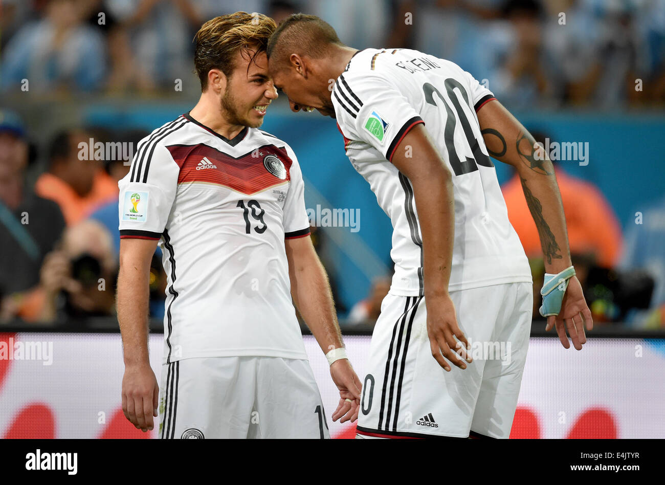 Rio de Janeiro, Brazil. 13th July, 2014. Mario Goetze (L) of Germany celebrates with teammate Jerome Boateng after scoring 1-0 goal during the FIFA World Cup 2014 final soccer match between Germany and Argentina at the Estadio do Maracana in Rio de Janeiro, Brazil, 13 July 2014. Photo: Marcus Brandt/dpa/Alamy Live News Stock Photo