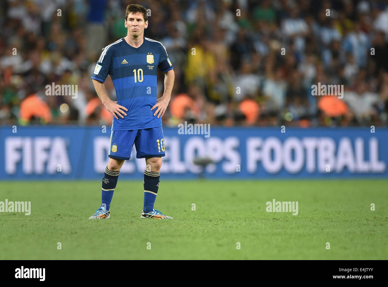 Rio de Janeiro, Brazil. 13th July, 2014. Dejected Lionel Messi of Argentina looks on after the FIFA World Cup 2014 final soccer match between Germany and Argentina at the Estadio do Maracana in Rio de Janeiro, Brazil, 13 July 2014. Photo: Andreas Gebert/dpa/Alamy Live News Stock Photo