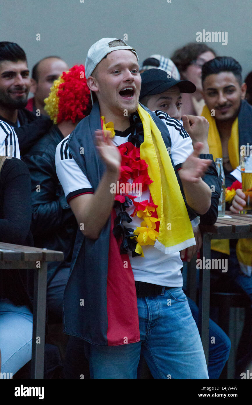 German football fans watch their team play in the World Cup final. Credit:  Gruffydd Thomas/Alamy Live News Stock Photo