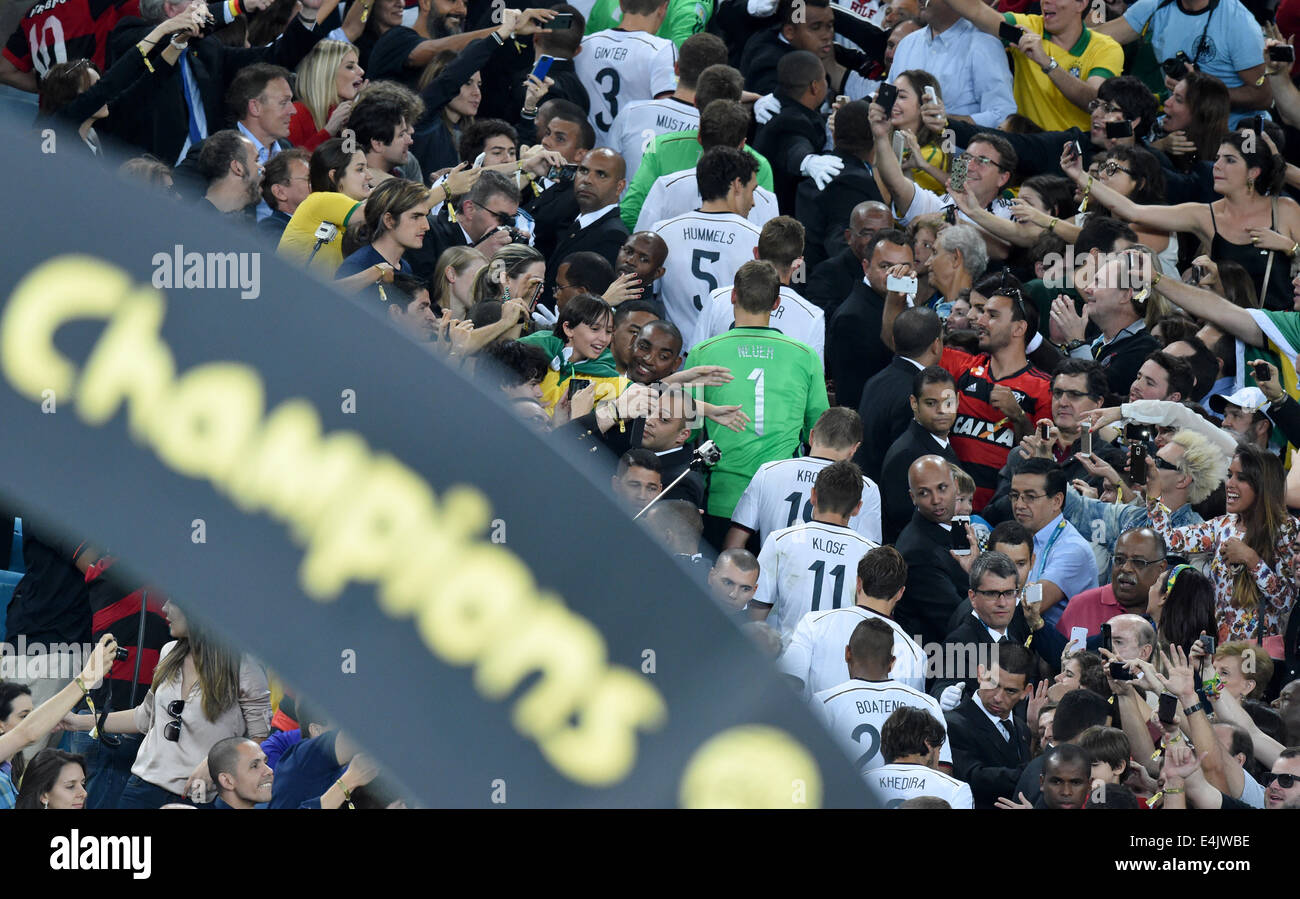 Rio de Janeiro, Brazil. 13th July, 2014. German team on their way to get the gold medals and the World Cup after winning the FIFA World Cup 2014 final soccer match between Germany and Argentina at the Estadio do Maracana in Rio de Janeiro, Brazil, 13 July 2014. Photo: Marcus Brandt/dpa/Alamy Live News Stock Photo