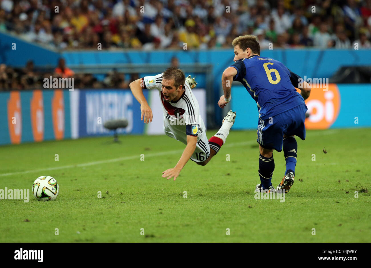 Rio de Janeiro, Brazil. 13th July, 2014. World Cup Final. Germany v Argentina. Lahm is fouled as he skips past Biglia Credit:  Action Plus Sports/Alamy Live News Stock Photo