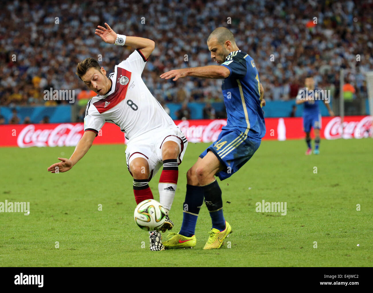 Rio de Janeiro, Brazil. 13th July, 2014. World Cup Final. Germany v Argentina. Ozil and Mascherano Credit:  Action Plus Sports/Alamy Live News Stock Photo
