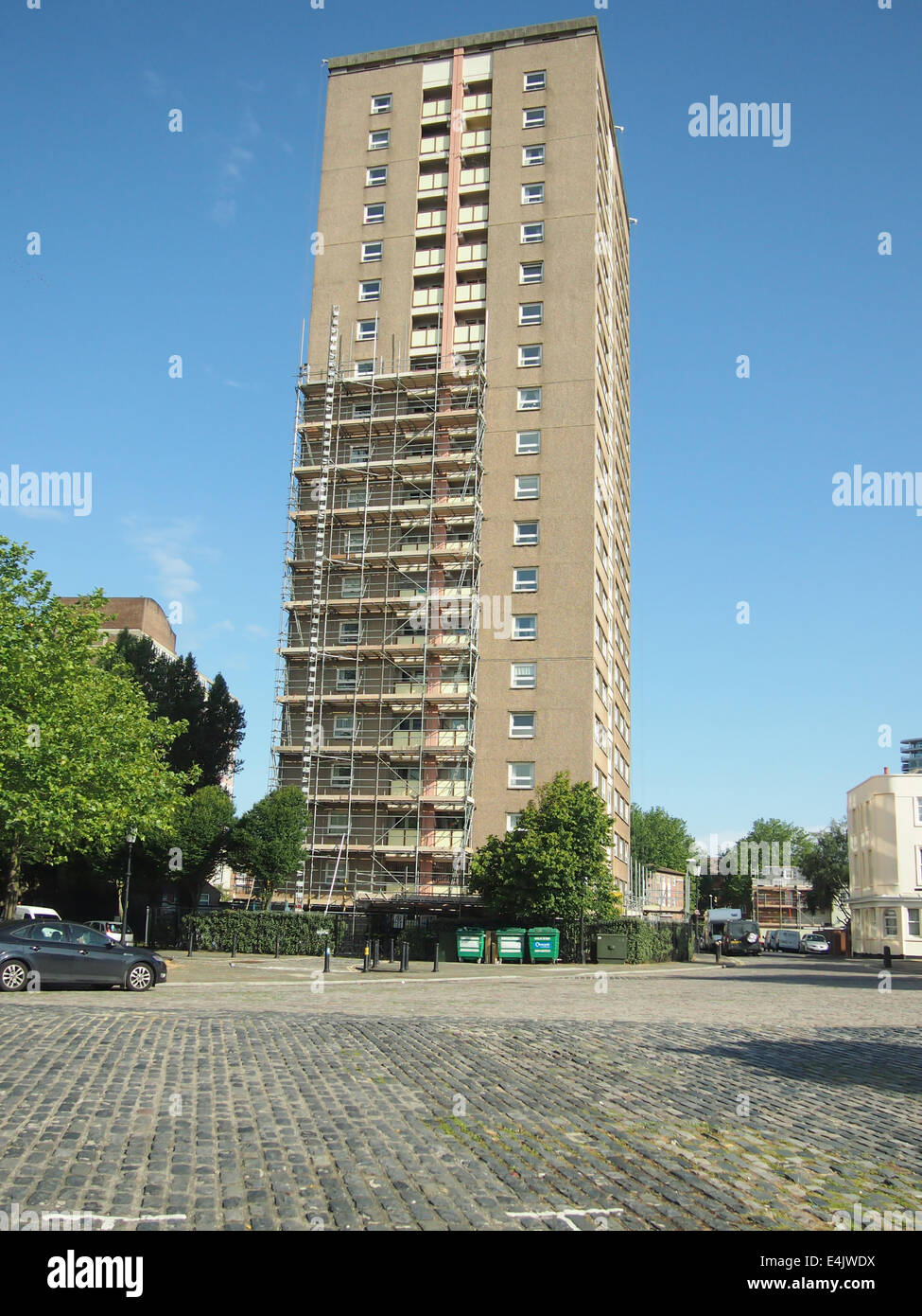 High rise tower block undergoing repair with scaffolding around the outside Stock Photo