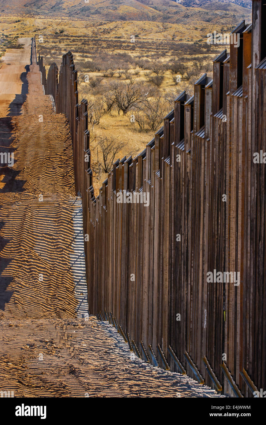 Massive 16 foot tall US border fence on border with Mexico,  6 miles east of Nogales Arizona, USA, looking east from US side Stock Photo