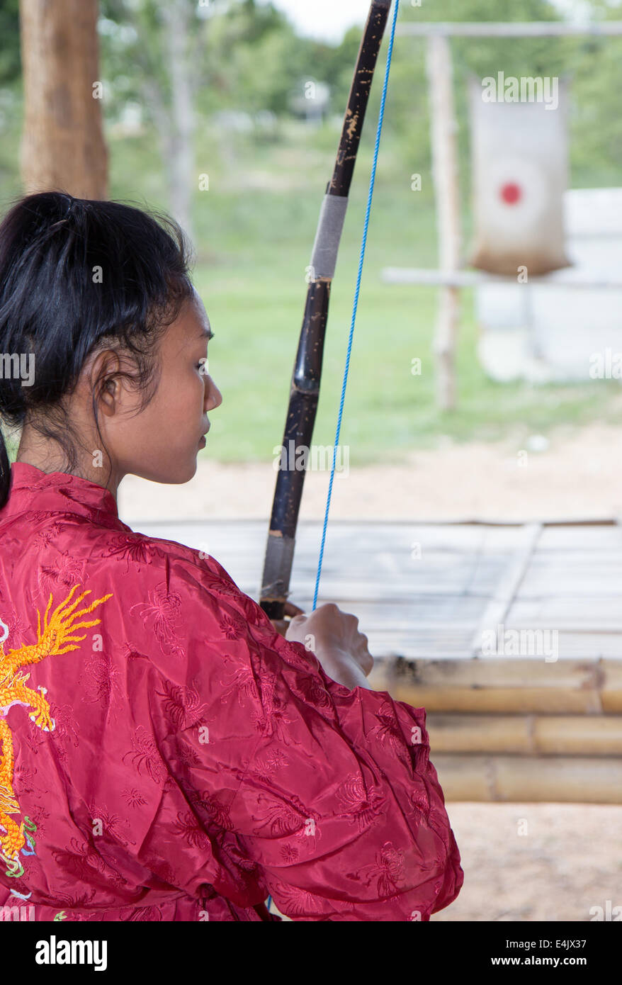 young Asian woman practicing archery Stock Photo