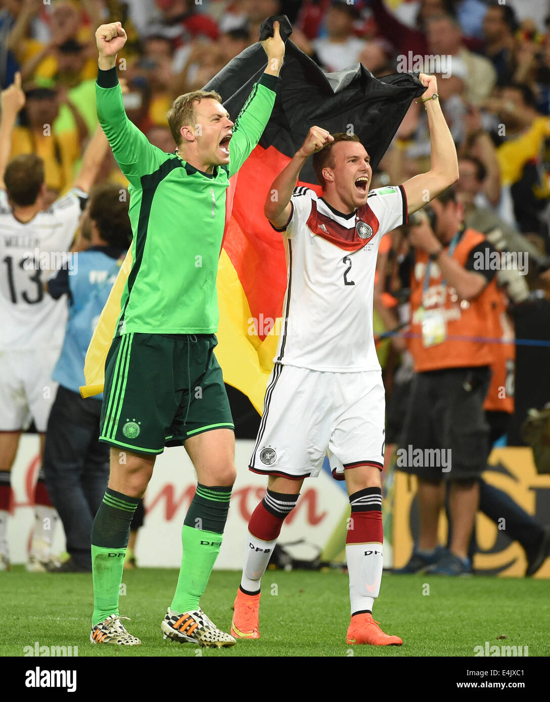 Rio De Janeiro, Brazil. 13th July, 2014. Germany's Kevin Grosskreutz (R) and goalkeeper Manuel Neuer celebrate their victory after the final match between Germany and Argentina of 2014 FIFA World Cup at the Estadio do Maracana Stadium in Rio de Janeiro, Brazil, on July 13, 2014. Germany won 1-0 over Argentina after 120 minutes and took its fourth World Cup title on Sunday. Credit:  Liu Dawei/Xinhua/Alamy Live News Stock Photo
