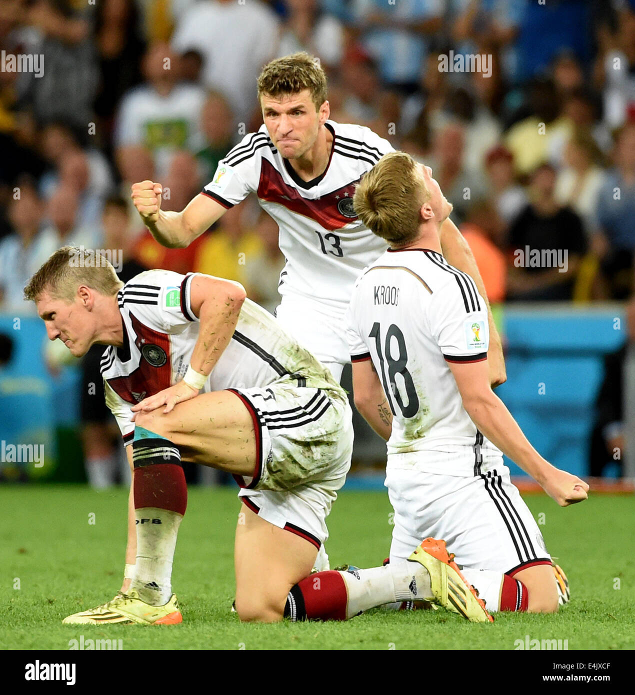 Rio De Janeiro, Brazil. 13th July, 2014. Germany's Toni Kroos, Thomas Muller and Bastian Schweinsteiger (R to L) celebrate their victory after the final match between Germany and Argentina of 2014 FIFA World Cup at the Estadio do Maracana Stadium in Rio de Janeiro, Brazil, on July 13, 2014. Germany won 1-0 over Argentina after 120 minutes and took its fourth World Cup title on Sunday. Credit:  Liu Dawei/Xinhua/Alamy Live News Stock Photo