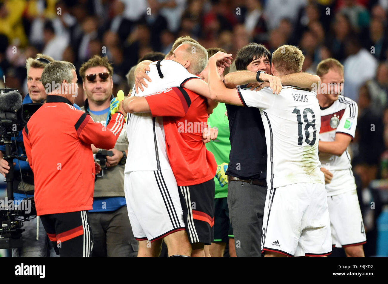 Rio De Janeiro, Brazil. 13th July, 2014. Germany's coach Joachim Loew (3rd R) celebrates the victory with Toni Kroos (2nd R) after the final match between Germany and Argentina of 2014 FIFA World Cup at the Estadio do Maracana Stadium in Rio de Janeiro, Brazil, on July 13, 2014. Germany won 1-0 over Argentina after 120 minutes and took its fourth World Cup title on Sunday. Credit:  Liu Dawei/Xinhua/Alamy Live News Stock Photo
