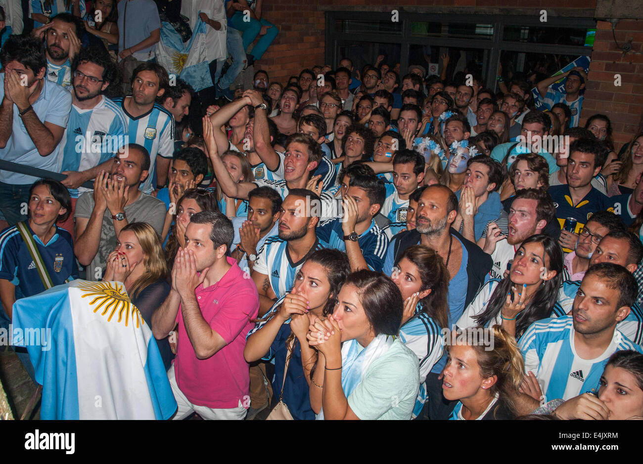 London, UK. 13th July, 2014.  Disappointed Argentinian football fans  watch on as their team id defeated by Germany in the World Cup 2014 final at an Argentinian pub, Moo on London's Vauxhall Bridge Road, Pimlico. Credit:  Mamusu Kallon/Alamy Live News Stock Photo