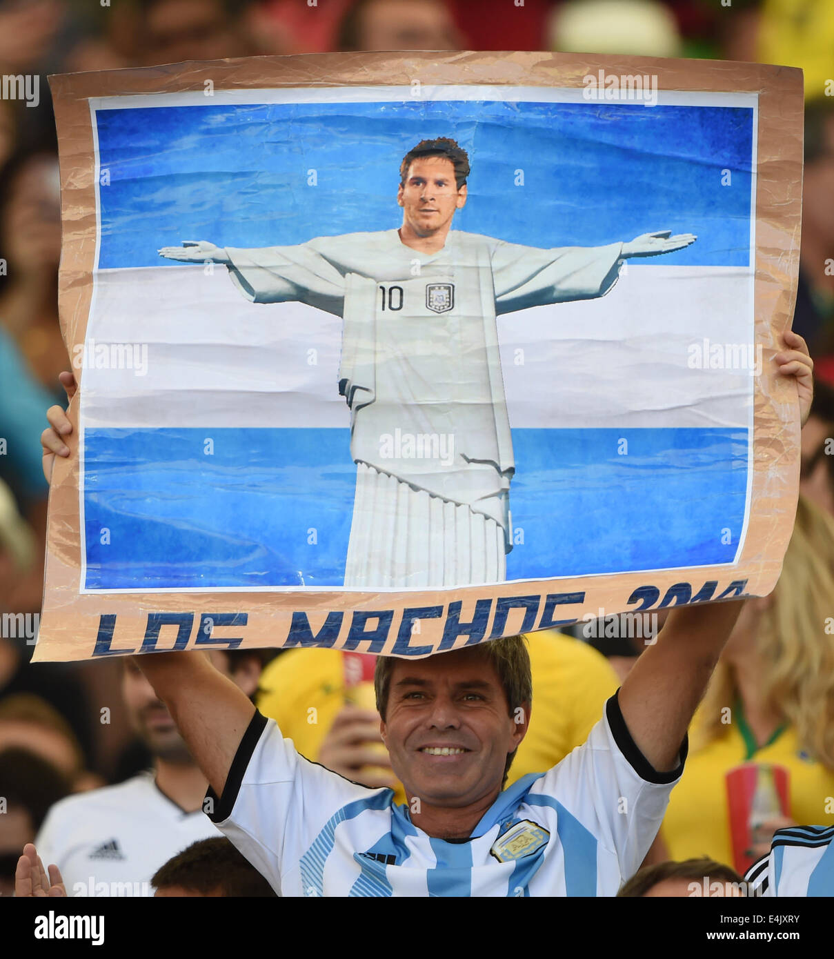 Rio De Janeiro, Brazil. 13th July, 2014. An Argentina's fan holds a poster of Lionel Messi before the final match between Germany and Argentina of 2014 FIFA World Cup at the Estadio do Maracana Stadium in Rio de Janeiro, Brazil, on July 13, 2014. Credit:  Yang Lei/Xinhua/Alamy Live News Stock Photo