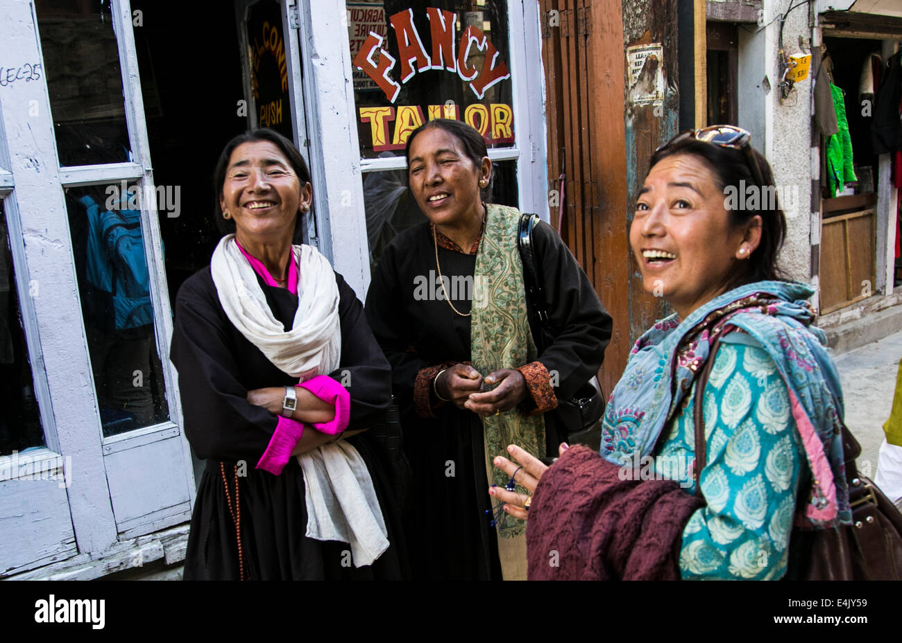 Women chat on the street in Leh Stock Photo
