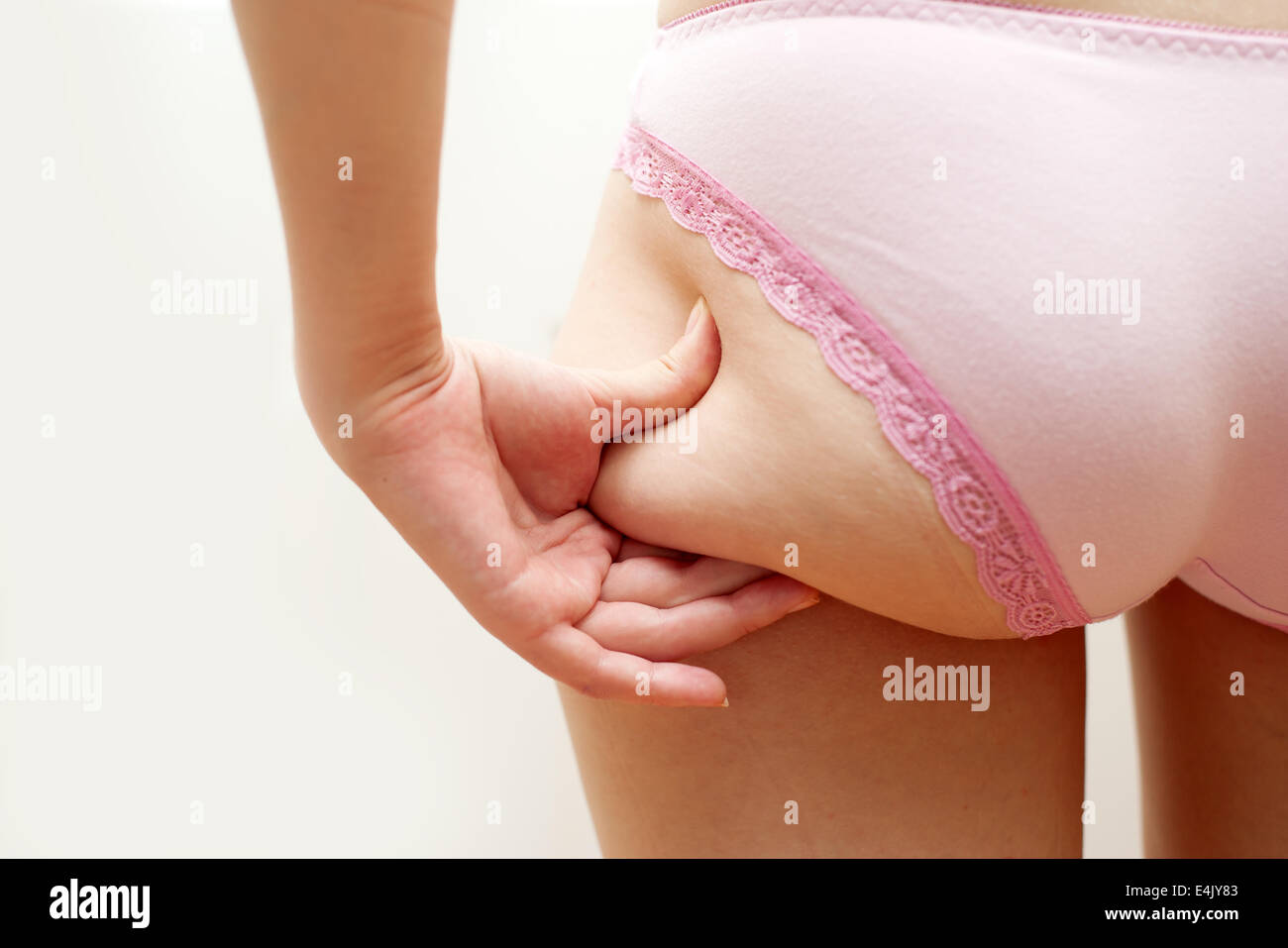 Girls in panties A young girl in underwear checking cellulite on her buttocks Stock Photo -  Alamy