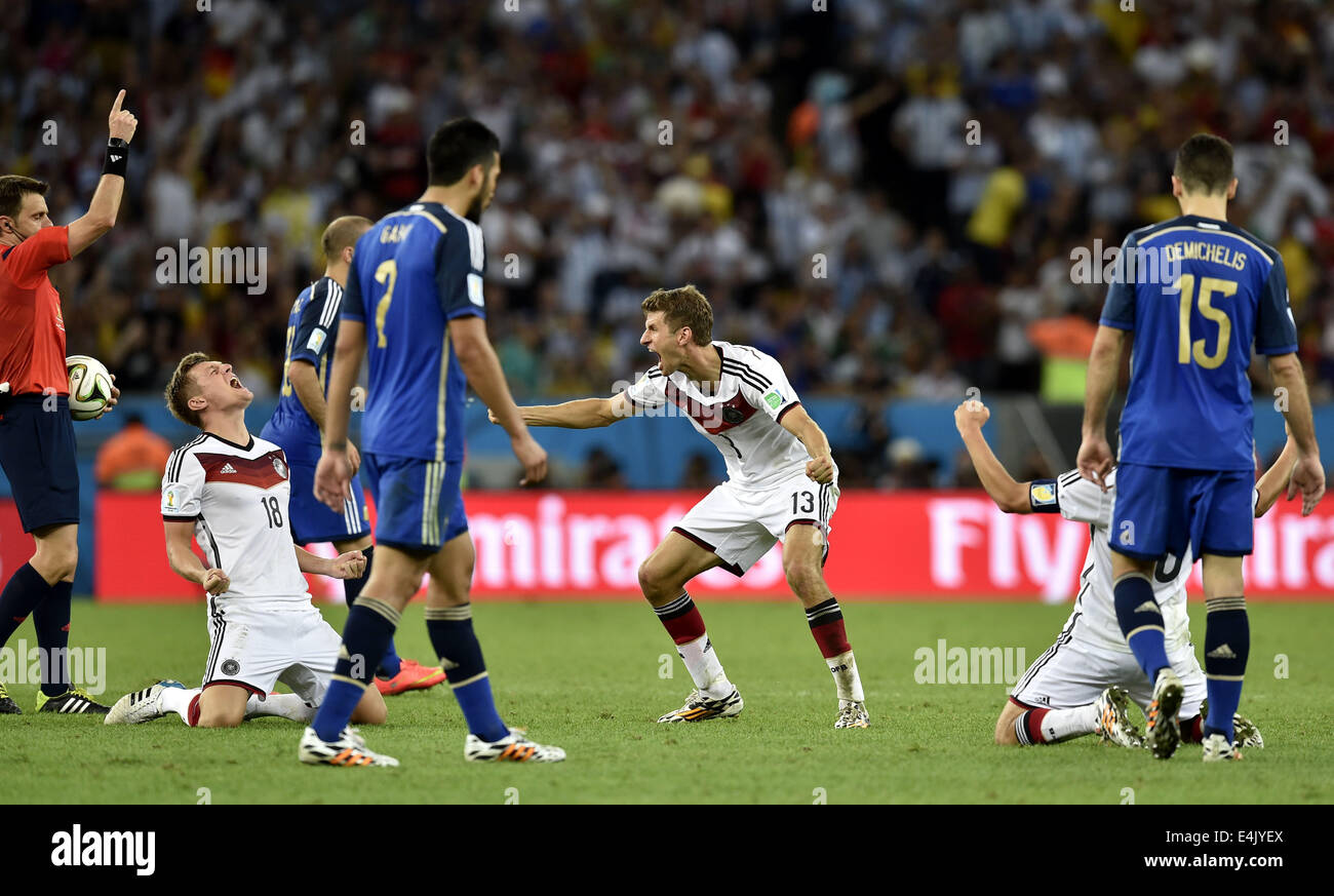 Rio De Janeiro, Brazil. 13th July, 2014. Germany's Thomas Muller (C) and Toni Kroos (2nd L) react as Italy's referee Nicola Rizzoli (1st L) whistles the end of the final match between Germany and Argentina of 2014 FIFA World Cup at the Estadio do Maracana Stadium in Rio de Janeiro, Brazil, on July 13, 2014. Germany won 1-0 over Argentina after 120 minutes and took its fourth World Cup title on Sunday. Credit:  Qi Heng/Xinhua/Alamy Live News Stock Photo