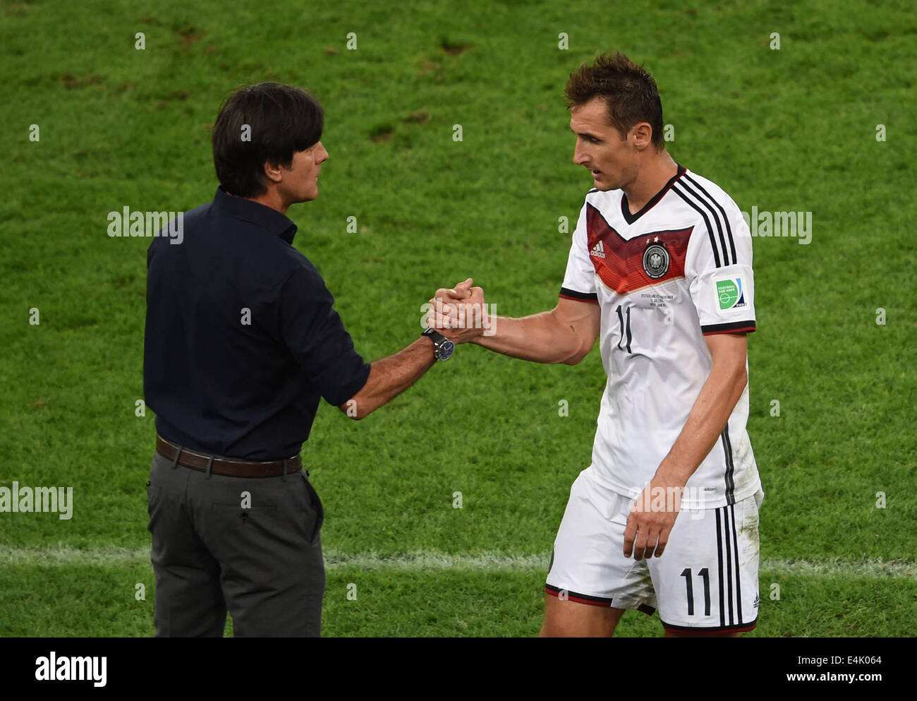 Rio De Janeiro, Brazil. 13th July, 2014. Germany's coach Joachim Loew (L) shakes hands with Miroslav Klose during the final match between Germany and Argentina of 2014 FIFA World Cup at the Estadio do Maracana Stadium in Rio de Janeiro, Brazil, on July 13, 2014. Credit:  Li Ga/Xinhua/Alamy Live News Stock Photo
