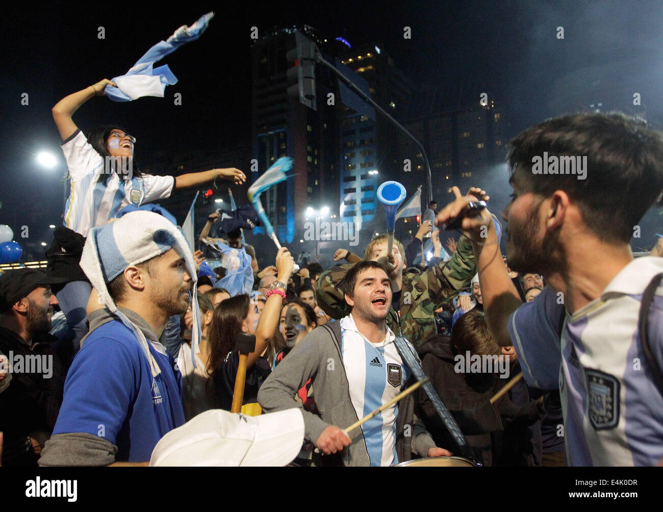 Buenos Aires, Argentina. 13th July, 2014. Residents react after the final match between Germany and Argentina of 2014 FIFA World Cup in the Obelisk, in Buenos Aires, Argentina, on July 13, 2014. Credit:  Pablo Valora/Xinhua/Alamy Live News Stock Photo
