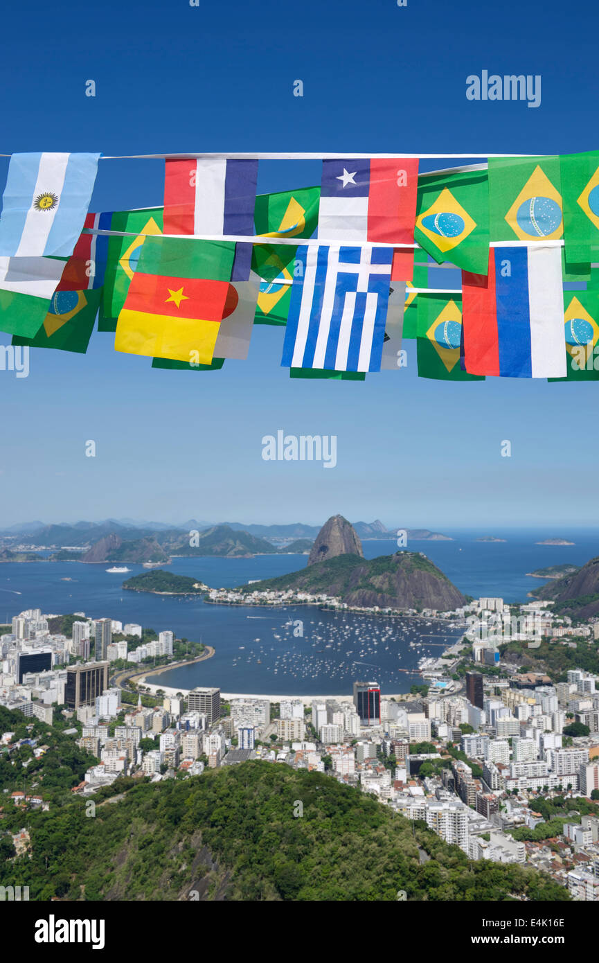 Brazilian and international flags bunting decoration above scenic overlook of Rio de Janeiro Brazil with Sugarloaf Pao de Acucar Stock Photo