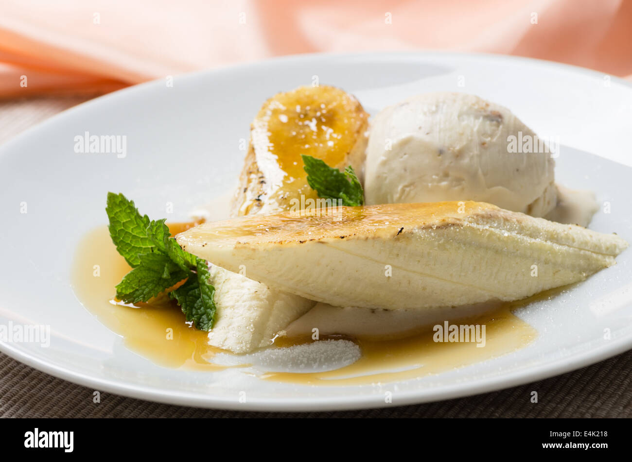 Dessert made with caramelized bananas vanila ice cream and mint Stock Photo
