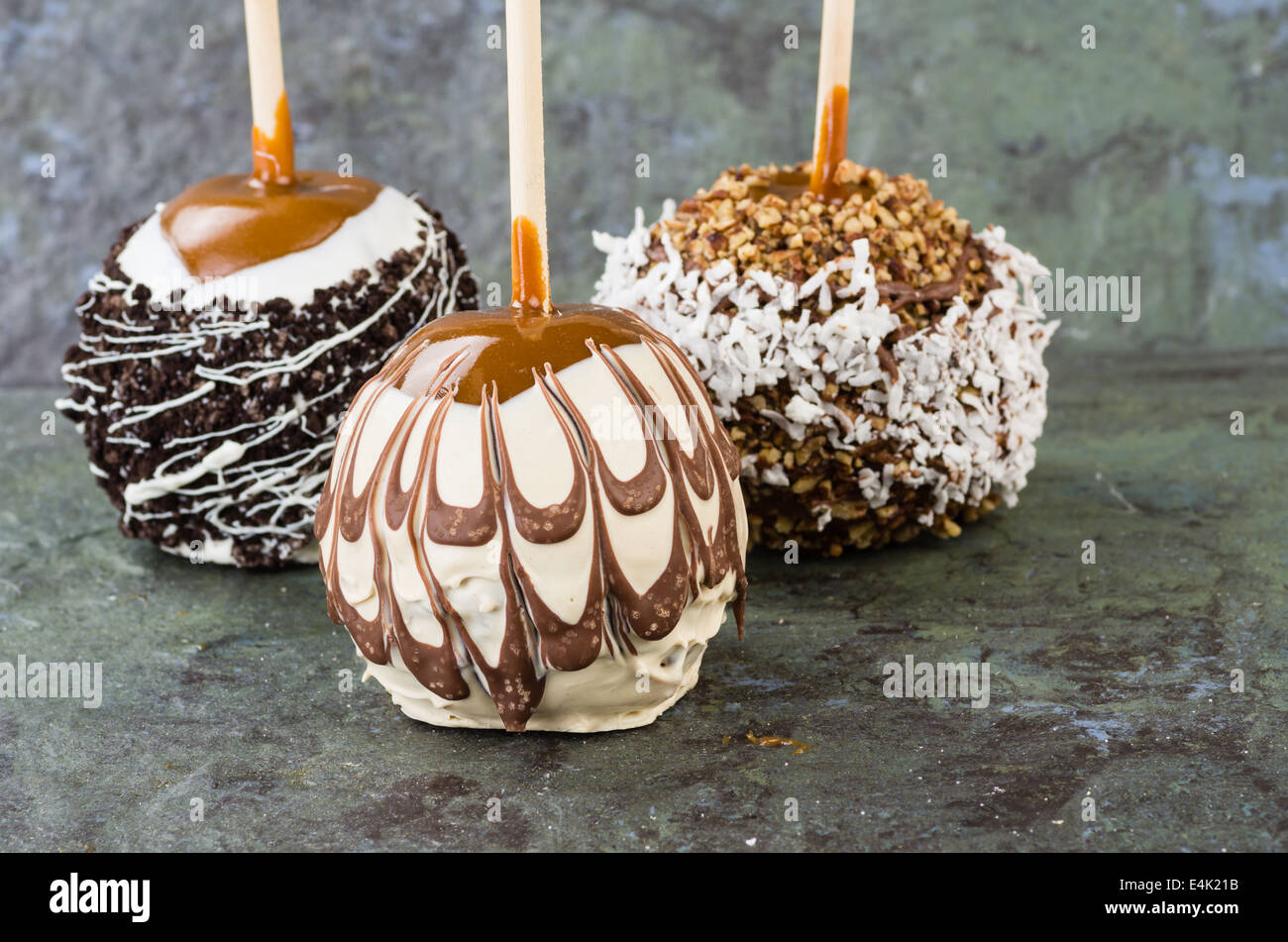 Sweet chocolate or caramel covered apples with nuts Stock Photo