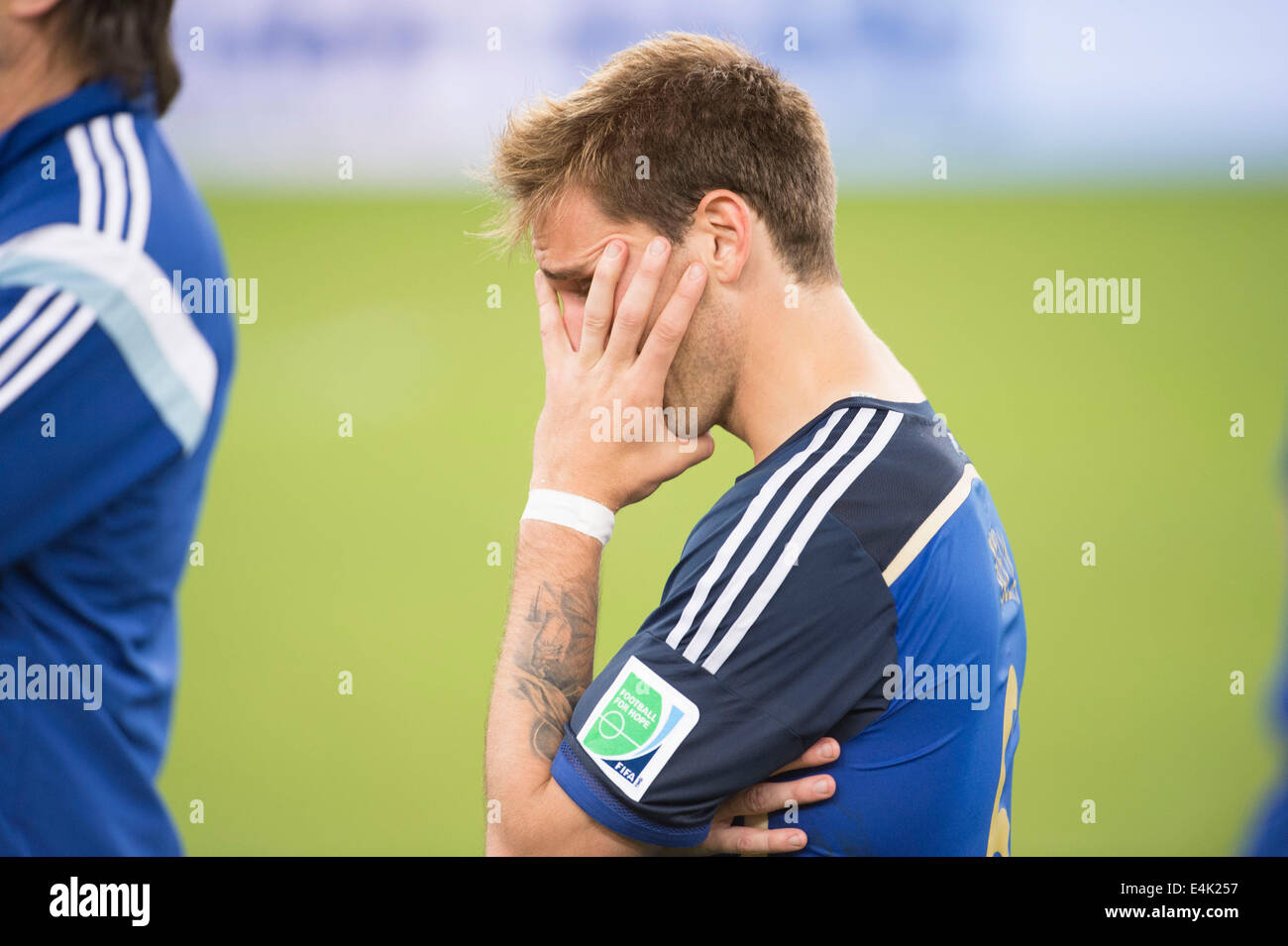 Rio de Janeiro, Brazil. 13th July, 2014. Lucas Biglia (ARG) Football/Soccer : Lucas Biglia of Argentina looks dejected after the FIFA World Cup Brazil 2014 Final match between Germany 1-0 Argentina at the Maracana stadium in Rio de Janeiro, Brazil . Credit:  Maurizio Borsari/AFLO/Alamy Live News Stock Photo