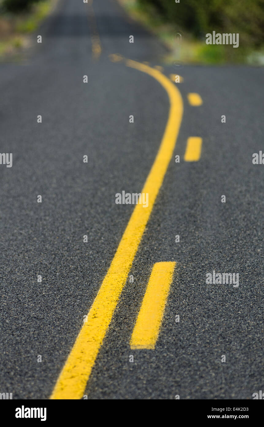 Yellow traffic control lines on a rural roadway Stock Photo Alamy