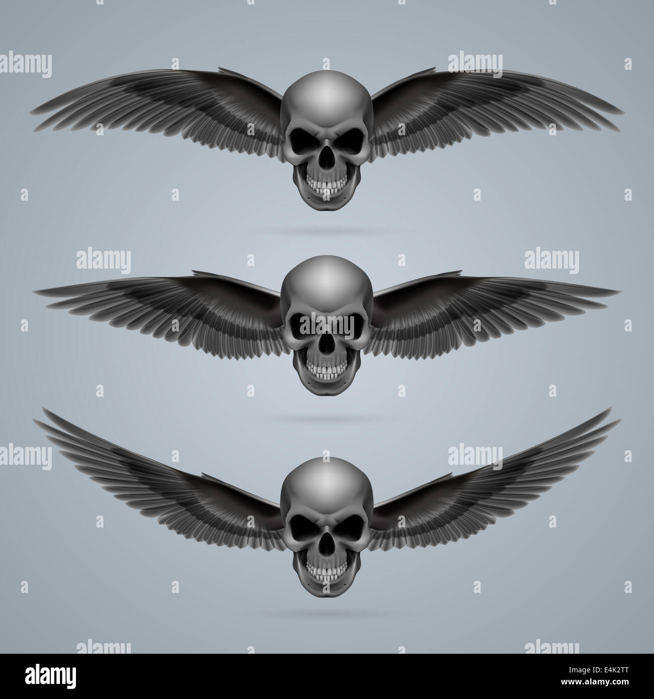 Three evil looking skulls with two wings each. Stock Photo