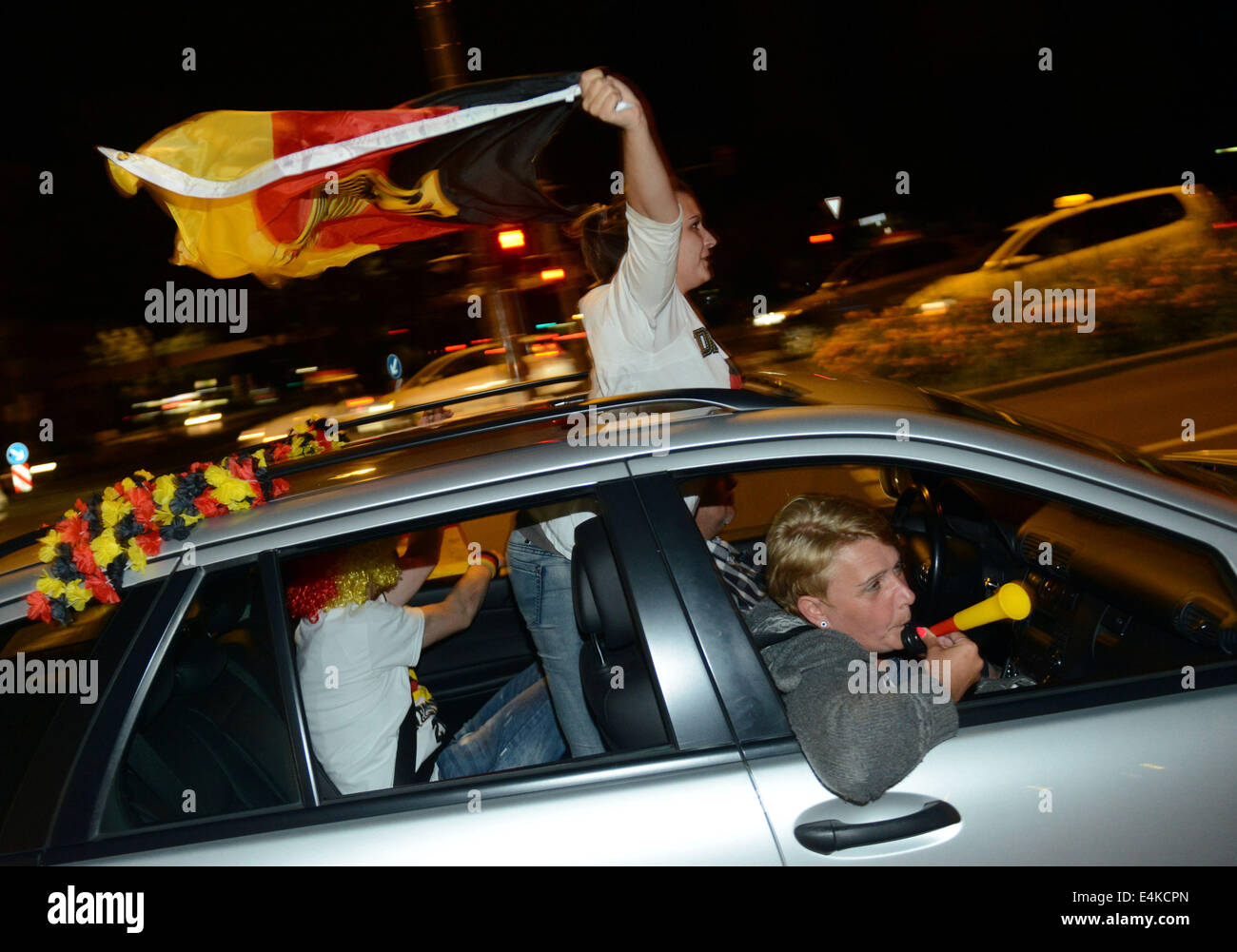 Dortmund, Germany. 13th July, 2014. Soccer fans cheer after the FIFA World Cup 2014 Final match between Germany and Argentina in Dortmund, Germany, 13 July 2014. Germany won over Argentina 1-0, and became World Champion. Photo: Caroline Seidel/dpa/Alamy Live News Stock Photo