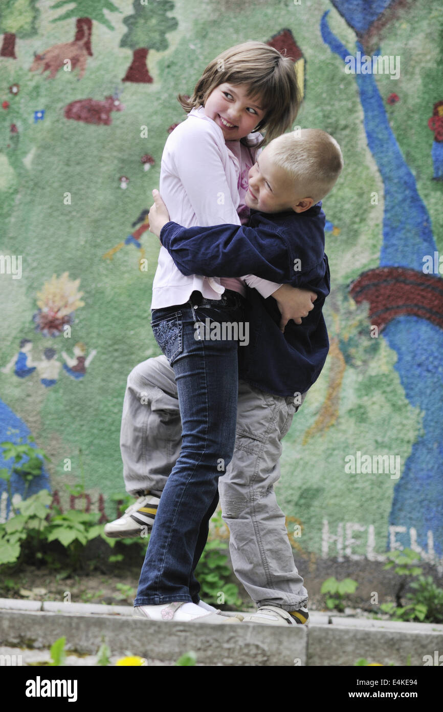 happy brother and sister outdoor in park Stock Photo - Alamy